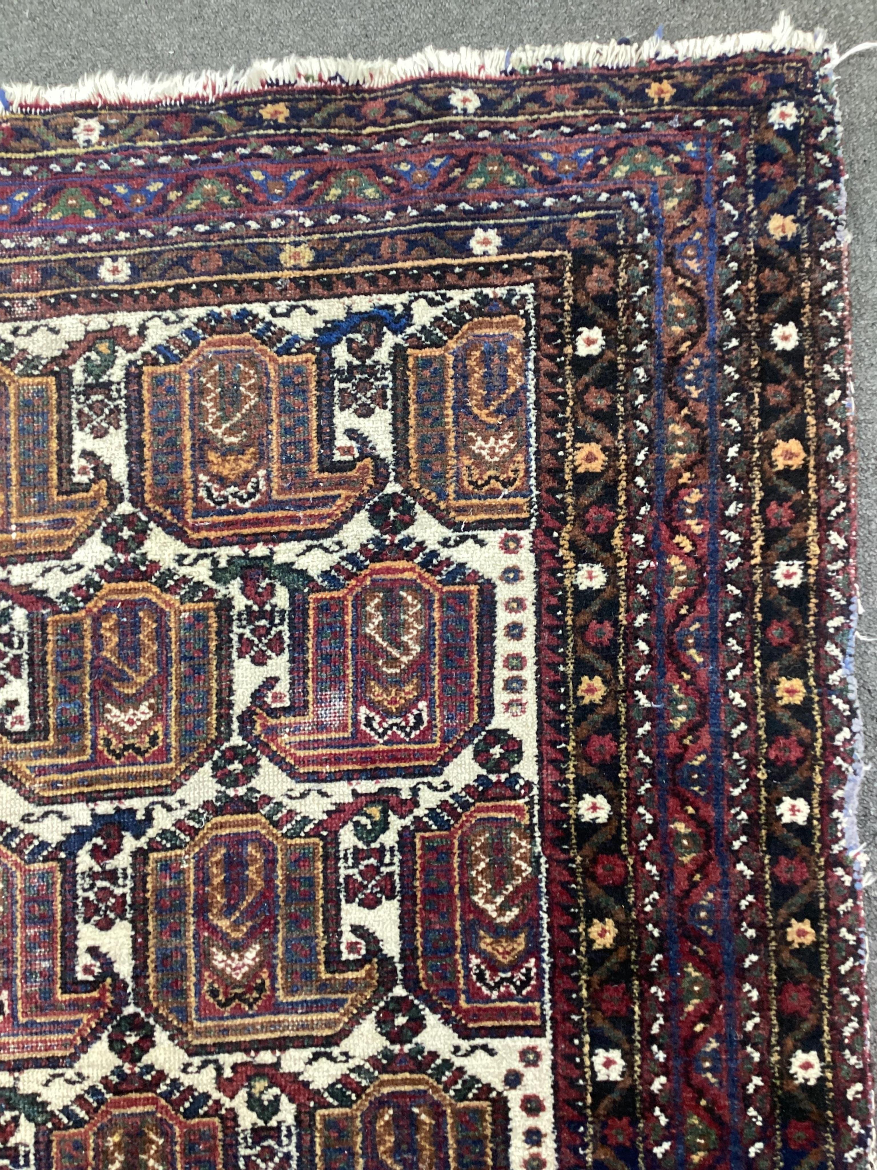 An Afshar ivory ground rug, 200 x 156cm. Condition - fair